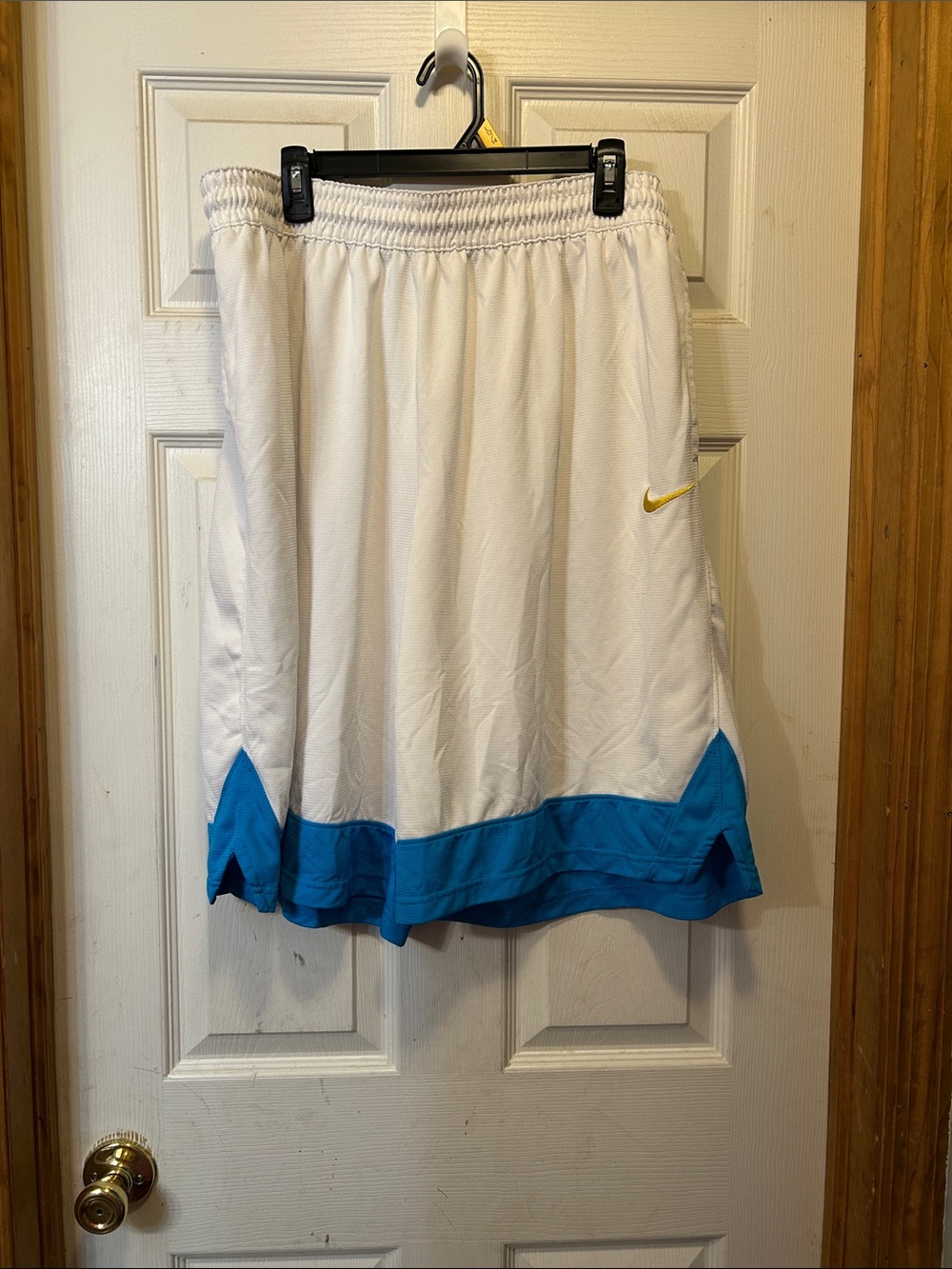 Nike White Basketball Shorts with Blue Hem and Gold Swoosh
